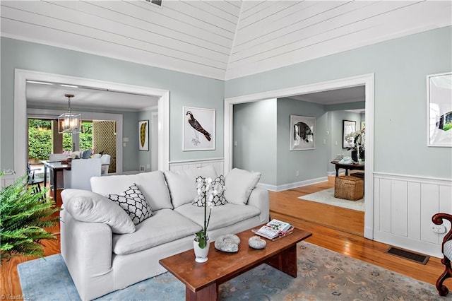 968 Avon Rd, Winston-Salem, NC 27104 - living area featuring wood finished floors and a wainscoted wall