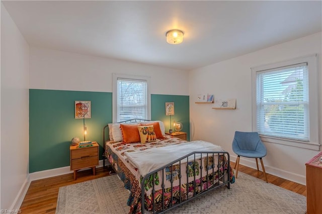 bedroom with wood-type flooring