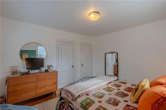 bedroom with light hardwood / wood-style flooring