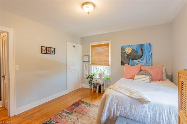 bedroom with hardwood / wood-style floors