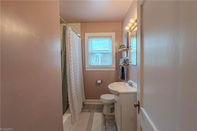 full bathroom with tile patterned flooring, vanity, shower / tub combo, and toilet