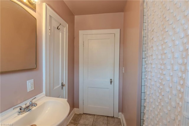 bathroom with tile patterned flooring and sink