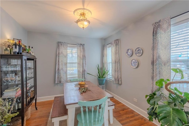 dining area with hardwood / wood-style floors