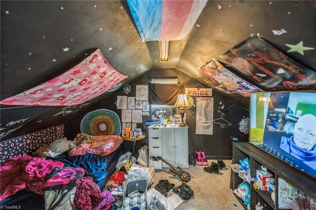 recreation room with lofted ceiling and carpet
