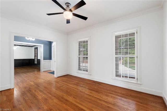 unfurnished room featuring crown molding, a ceiling fan, and wood finished floors