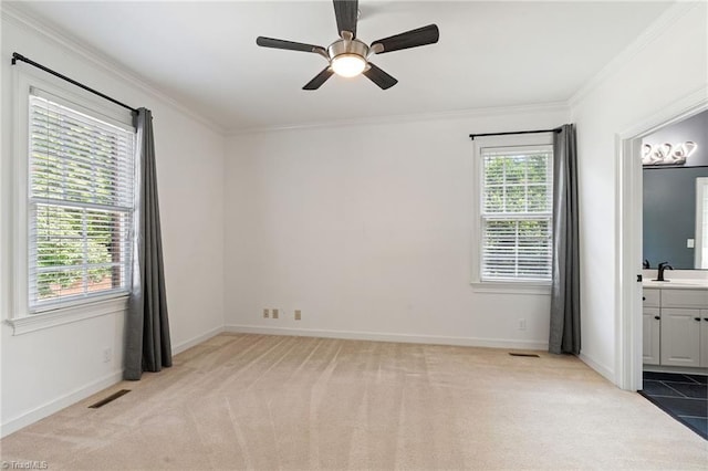 unfurnished bedroom with carpet flooring, crown molding, and baseboards