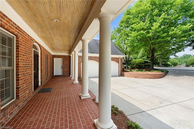 view of patio featuring concrete driveway