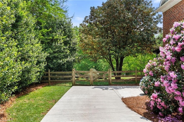 exterior space with a yard, a patio, and fence