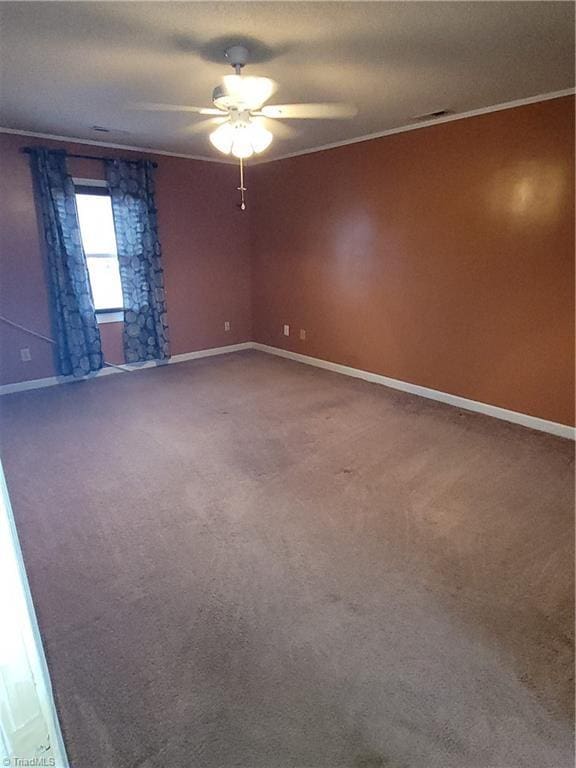 unfurnished room featuring carpet flooring, ceiling fan, and ornamental molding