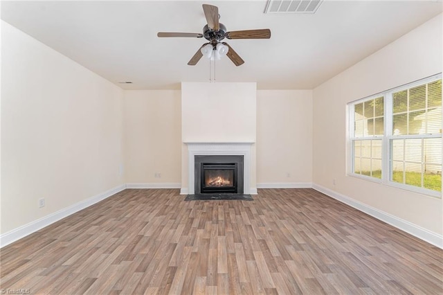 1771 Timber Cove Ct, Winston-Salem, NC 27127 - unfurnished living room with light wood-style floors, ceiling fan, baseboards, and a fireplace with flush hearth