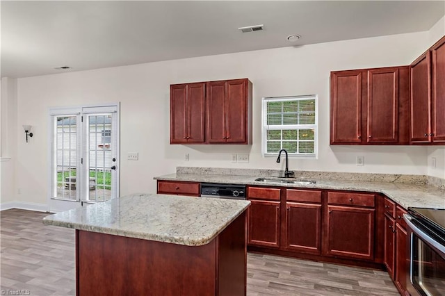 1771 Timber Cove Ct, Winston-Salem, NC 27127 - kitchen with a sink, dark brown cabinets, light wood-type flooring, and healthy amount of natural light