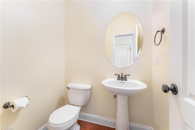 1771 Timber Cove Ct, Winston-Salem, NC 27127 - bathroom featuring toilet, baseboards, and wood finished floors