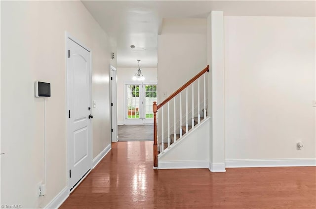 1771 Timber Cove Ct, Winston-Salem, NC 27127 - entrance foyer with wood finished floors, baseboards, and a chandelier
