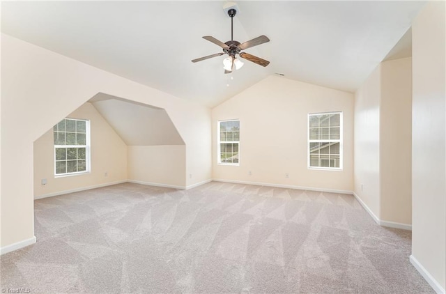 1771 Timber Cove Ct, Winston-Salem, NC 27127 - additional living space with vaulted ceiling, light carpet, plenty of natural light, a ceiling fan, and baseboards