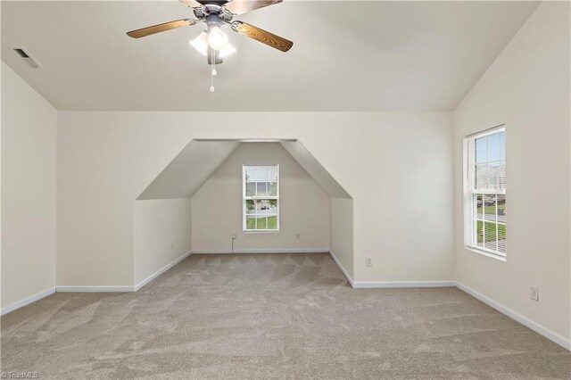 1771 Timber Cove Ct, Winston-Salem, NC 27127 - additional living space featuring light carpet, vaulted ceiling, baseboards, and ceiling fan