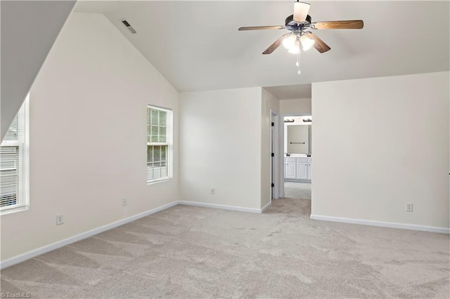 1771 Timber Cove Ct, Winston-Salem, NC 27127 - unfurnished room featuring light carpet, ceiling fan, vaulted ceiling, and baseboards