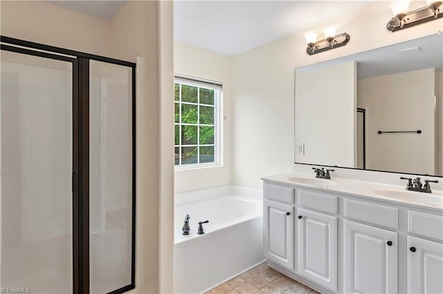 1771 Timber Cove Ct, Winston-Salem, NC 27127 - bathroom featuring a stall shower, double vanity, and a garden tub