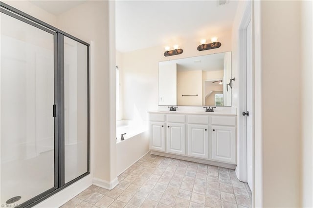 1771 Timber Cove Ct, Winston-Salem, NC 27127 - bathroom with a shower stall, a garden tub, double vanity, and baseboards