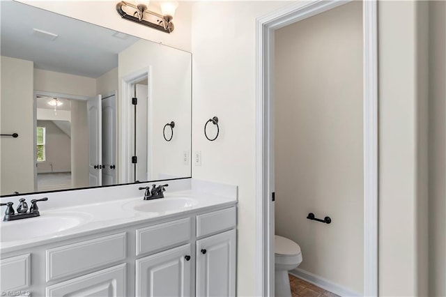 1771 Timber Cove Ct, Winston-Salem, NC 27127 - bathroom with double vanity, toilet, tile patterned flooring, and baseboards