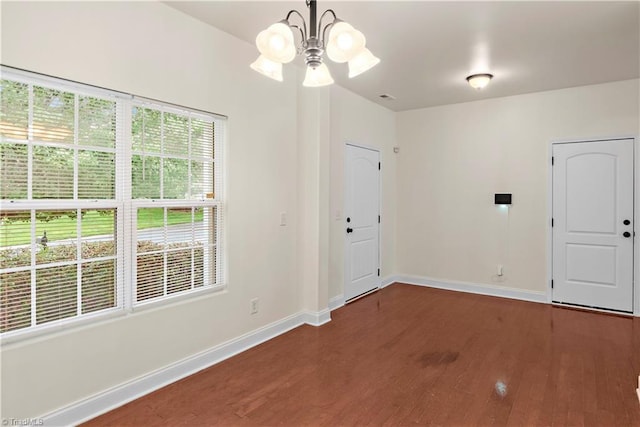1771 Timber Cove Ct, Winston-Salem, NC 27127 - entrance foyer featuring dark wood-type flooring, baseboards, and a chandelier