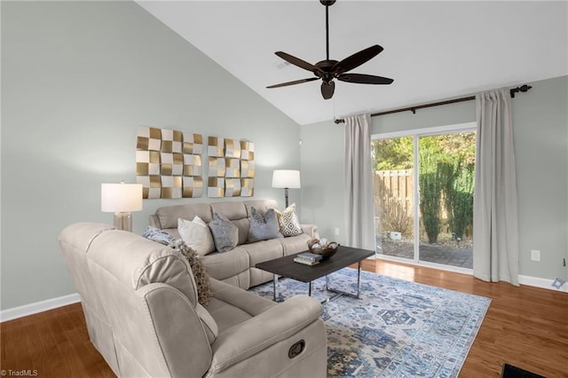 living room featuring dark hardwood / wood-style flooring, high vaulted ceiling, and ceiling fan