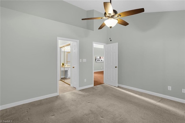 unfurnished bedroom with high vaulted ceiling, light carpet, and ceiling fan