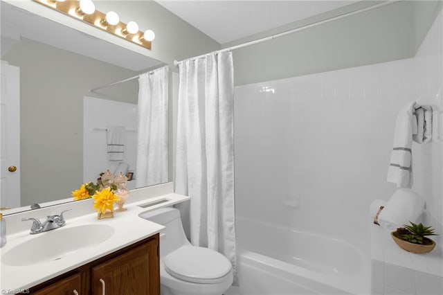 full bathroom featuring vanity, shower / bath combo, and toilet