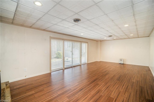 spare room with hardwood / wood-style flooring