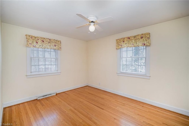 unfurnished room featuring hardwood / wood-style flooring and ceiling fan