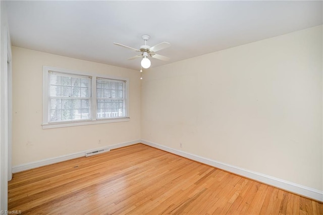 unfurnished room featuring ceiling fan and light wood-type flooring