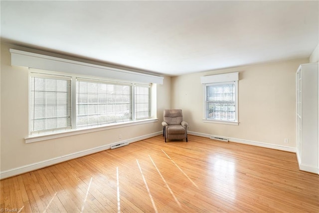 unfurnished room featuring light hardwood / wood-style floors