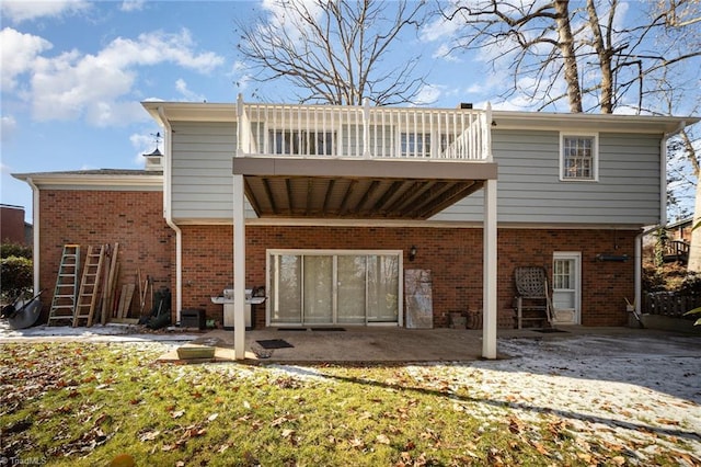 back of house with a patio