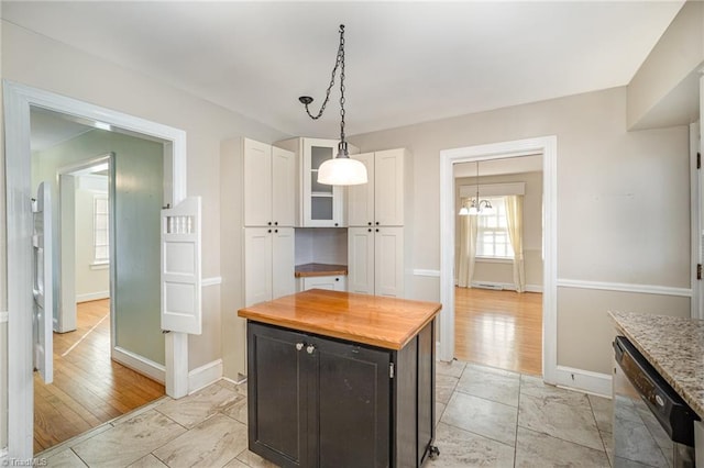 kitchen featuring light hardwood / wood-style flooring, dishwasher, a center island, and white cabinets