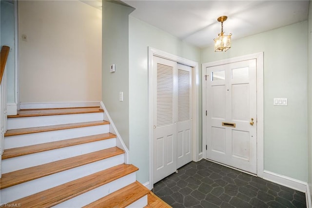 entrance foyer featuring a chandelier