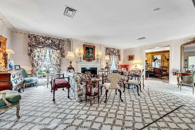 carpeted dining area with crown molding