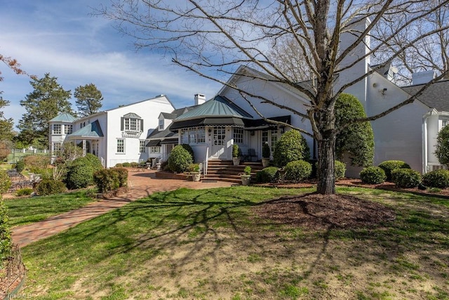 view of front of home with a front yard