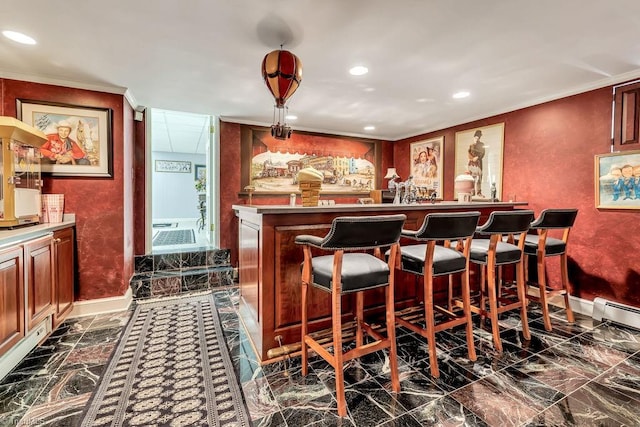 bar with a baseboard radiator and ornamental molding