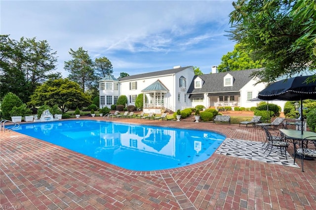 view of pool featuring a patio