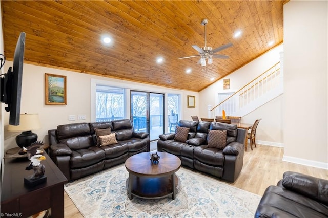 living area featuring lofted ceiling, wooden ceiling, baseboards, stairs, and light wood-type flooring