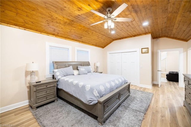 bedroom with light wood-type flooring, lofted ceiling, wood ceiling, and baseboards