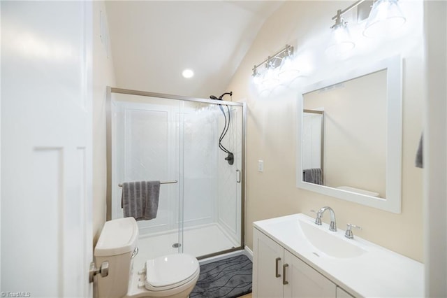 full bathroom with a stall shower, vanity, and toilet