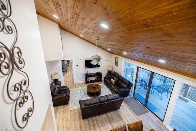 living room with recessed lighting, wood finished floors, wood ceiling, and a healthy amount of sunlight