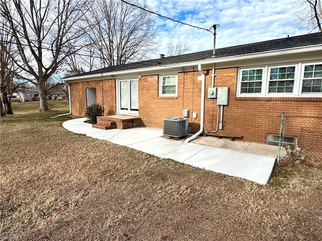 1604 E Fairfield Dr, Mount Airy, NC 27030 - back of property featuring brick siding and a patio area