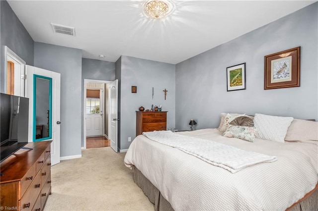 bedroom with light colored carpet