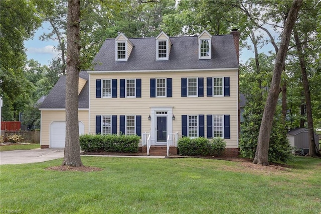 1113 Smokewood Dr, Apex, NC 27502 - view of front of house with an attached garage, a chimney, concrete driveway, and roof with shingles
