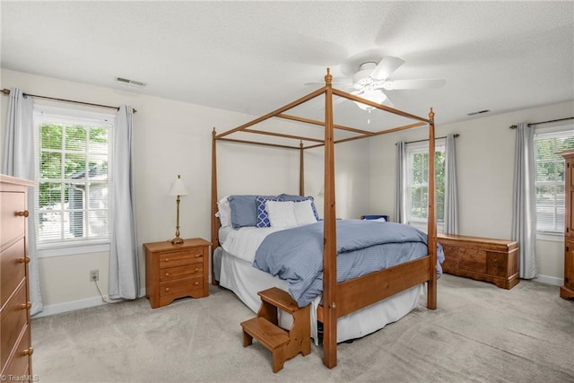 1113 Smokewood Dr, Apex, NC 27502 - carpeted bedroom featuring baseboards, ceiling fan, and a textured ceiling