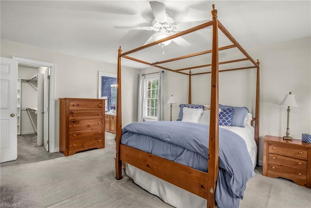 1113 Smokewood Dr, Apex, NC 27502 - bedroom featuring light carpet, a spacious closet, ceiling fan, and a closet