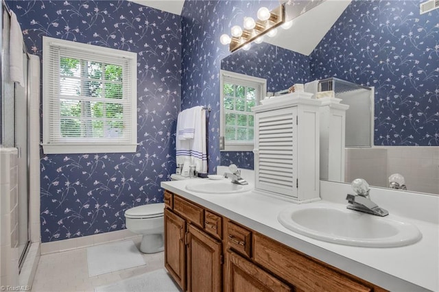1113 Smokewood Dr, Apex, NC 27502 - full bathroom with toilet, double vanity, tile patterned floors, an enclosed shower, and wallpapered walls