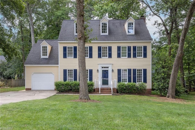 1113 Smokewood Dr, Apex, NC 27502 - colonial inspired home featuring a garage, concrete driveway, a chimney, and roof with shingles