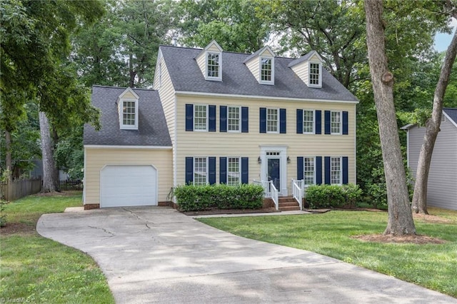 1113 Smokewood Dr, Apex, NC 27502 - view of front of home with concrete driveway, an attached garage, and a shingled roof